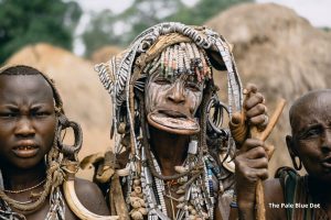 Ari Tribe Member with Face Paint and Jewelry. A Look At The Thriving Yet Simple Life of The Ari Tribe. Absolute Ethiopia